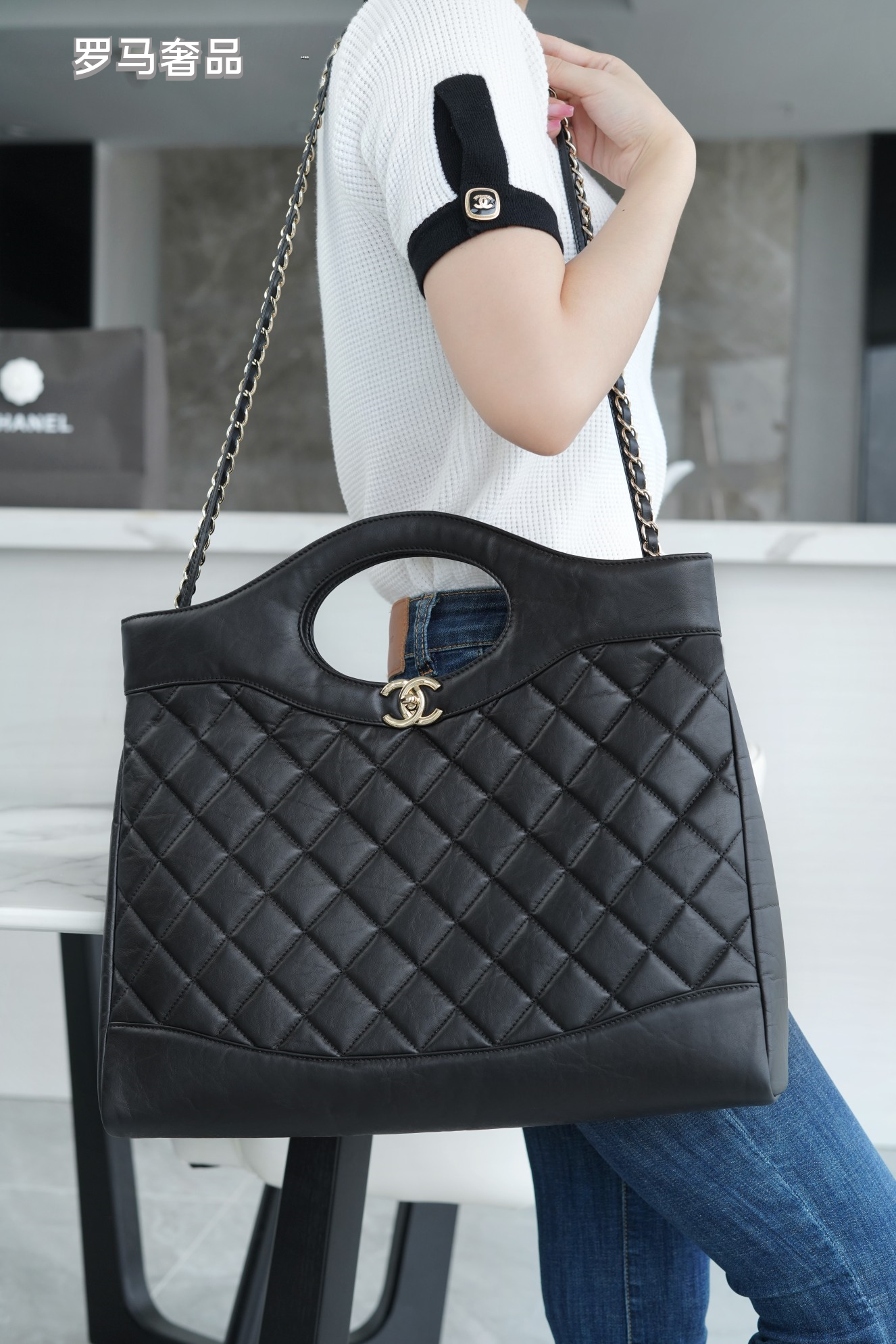Luxury Black Quilted Leather Handbag with Gold-Tone Chain Strap and Cut-Out Handles